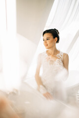 beautiful and gentle bride in a white lace wedding dress. 