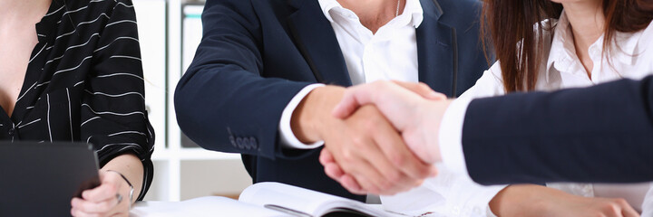 Group business peoples shake hands as hello in office closeup