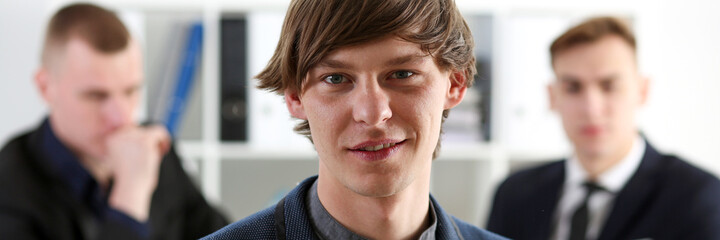 Fototapeta premium Handsome smiling businessman in suit portrait