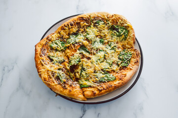 vegan pesto and spinach flatbread with dairy-free cheese, healthy plant-based food