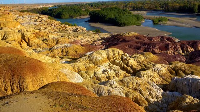 The colorful rocks were formed by wind and water erosion and long-term leaching. Colorful Beach(Rainbow Beach), Burqin Yadan landform, Irtysh River, Xinjiang, China. Sep. 2018