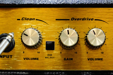 Close-up of the audio mixer, an electric guitar or bass amplifier.
