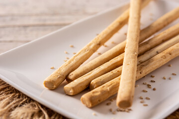 Breadstick grissini snack on rustic wooden table
