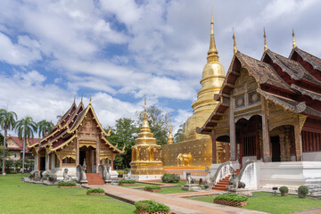 Beautiful panorama view of ubosot and golden stupa inside compound of famous landmark Wat Phra...