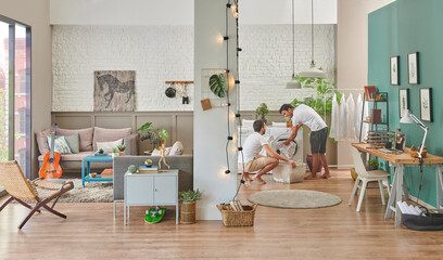There are two men at the same home, living together, men are cleaning their clothes, washing machine style.