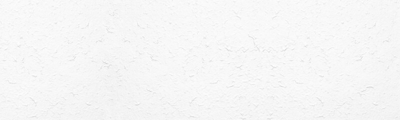 White rough textured surface. Whitewashed wall. Light wide large texture. Abstract panoramic background
