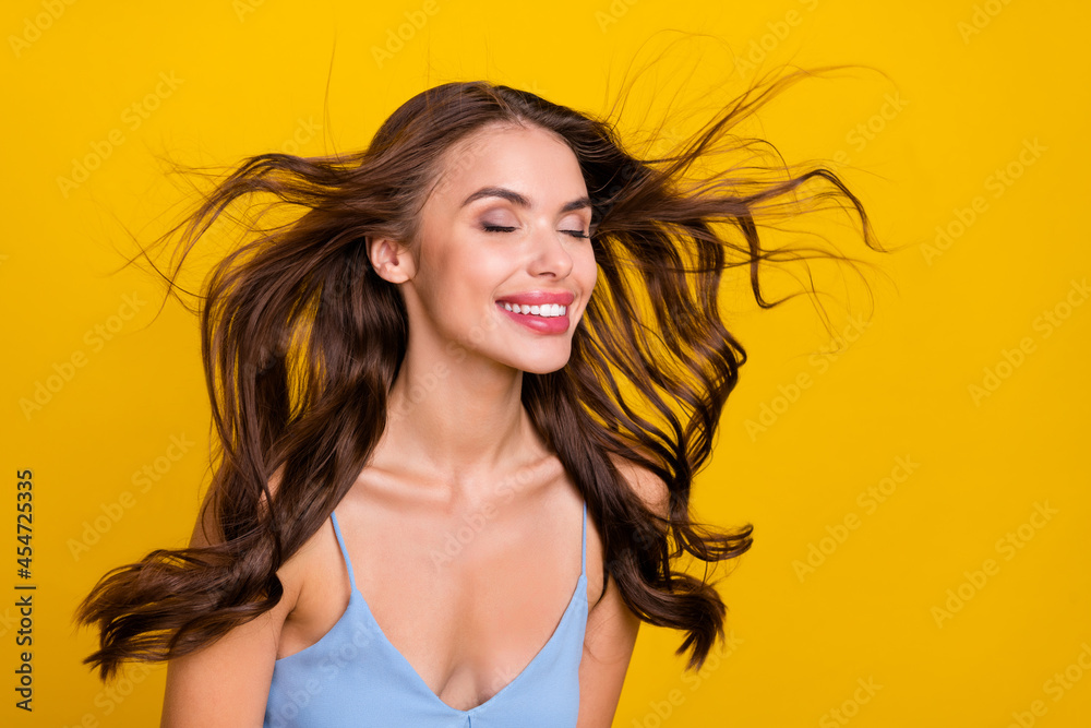 Sticker Profile side photo of young attractive woman happy positive smile wind blow haircare conditioner isolated over yellow color background