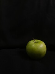 green apple on a black background