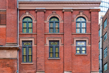 Obraz premium Colonial windows pattern in the exterior wall of the Massey Hall, Toronto, Canada