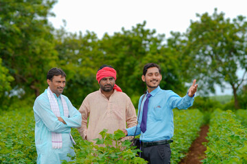 Indian farmer Discussing with agronomist at Farm and collecting some information