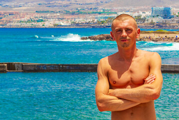 Young male model at Playa de las Americas Tenerife Africa.