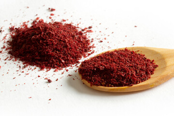 red chili powder in a wooden spoon