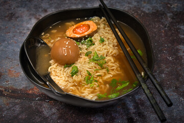 Ramen noodles in soy based broth with pickled egg