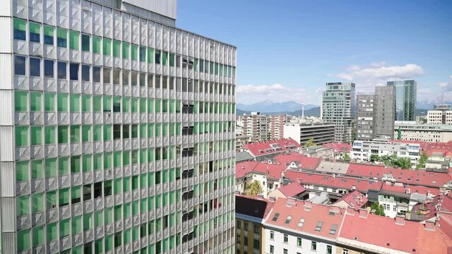 Ljubljana city skyscraper parallax motion with single building in focus 4K 