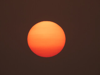 The setting sun disk with visible sunspots. Taken on October 27, 2020