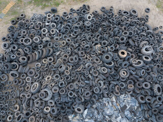 Close-up view from a drone on a large number of old, used tires