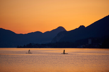SUP surfing on lake Wolfgang.