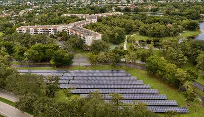 Aerial shot of solar panels in a cascade in the field in Florida