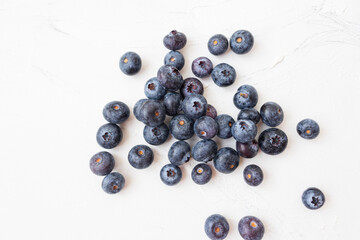 Lots of wet blueberry on white background.