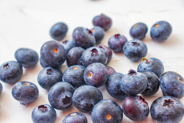 Lots of wet blueberry on white background.