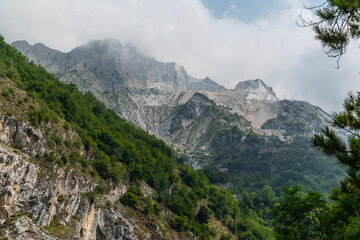 Fototapeta na wymiar View of the quarries of Carrara in clouds, Italy