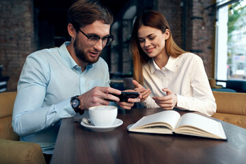 business man and woman sitting in cafe lunch communication lifestyle