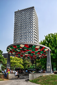 Tirana, Albania - June 21, 2021: Friendship Monument against the backdrop of the TID Tower skyscraper in Tirana. Famous landmarks of the Albanian capital