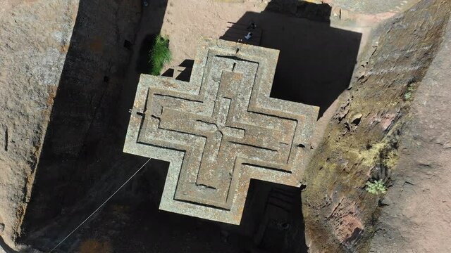 Aerial view of the monolithic rock-cut church of Saint George dated to the late 12th, Amhara Region, Lalibela, Ethiopia 