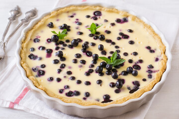 Blueberry pie on wooden table