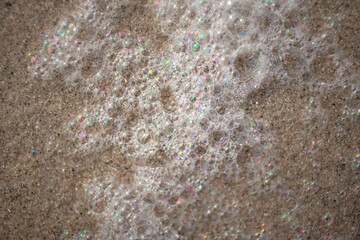 Beautiful colours in the sea foam along the dutch coast (Kijkduin, The Hague, The Netherlands)