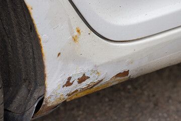 Rusty right wing covered with corrosive defect of iron