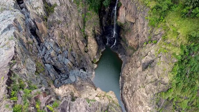 Aerial - waterfall creates hidden lagoon