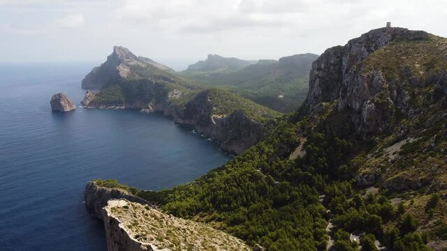 Beautiful Green And Rocky Landscape of Mirador Es Comer In Mallorca Spain - aerial shot
