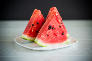 pieces of fresh ripe red watermelon on table