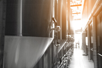 Large reservoirs, tanks and pipes with manometers in private microbrewery.