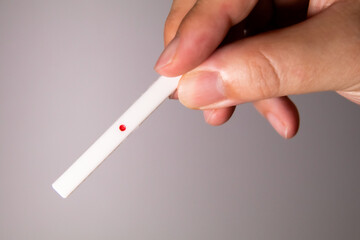 A man holding Mahjong point stick