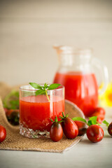 homemade freshly squeezed tomato juice with pulp in a glass decanter