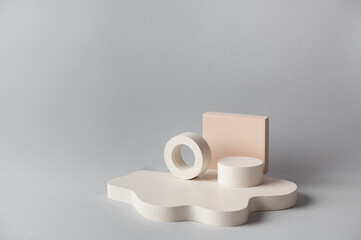 Minimal abstract cosmetic background for product presentation. Cosmetic bottle podium on grey color background. Pastel colors styled composition with geometrical forms. Minimal concept. Product mockup