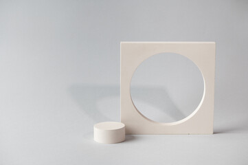 Minimal abstract cosmetic background for product presentation. Cosmetic bottle podium on grey color background. Pastel colors styled composition with geometrical forms. Minimal concept. Product mockup