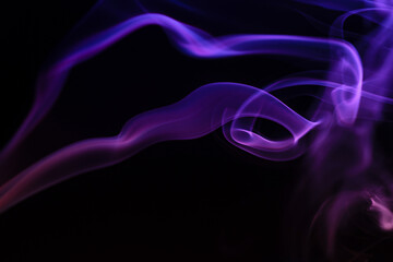 Obraz premium Abstract colored smoke hookah on dark background. Texture. Art Design element. Personal vaporizers fragrant steam. Concept of alternative non-nicotine smoking. E-cigarette. Evaporator.