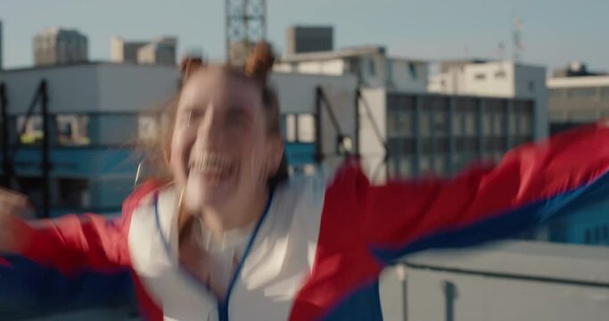 happy woman dancing on rooftop celebrating enjoying silly dance having fun crazy dancer girl in city