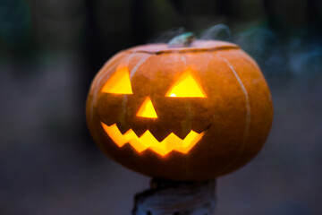 Horrible symbol of Halloween - Jack-o-lantern. Scary head of pumpkin with eyes glowing inside