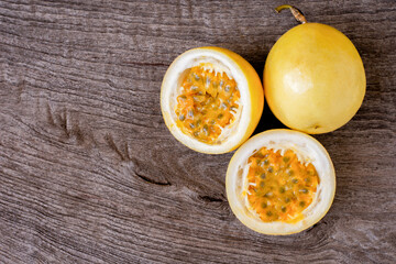 Yellow passion fruit on wood table