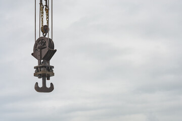 Detail of a pulley, a part of a bigger machinery in an industrial construction site, used to lift...