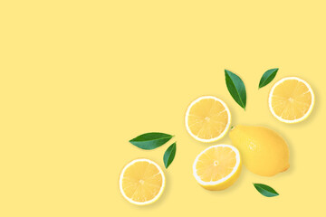Fresh organic lemon fruit with slice and green leaves isolated on yellow background . Top view. Flat lay. Copy space.