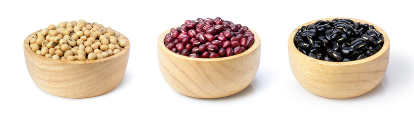Collection of legumes ; soybeans, red adzuki bean and black grams in wooden bowl isolated on white background.