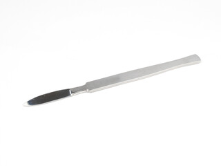 the steel medical scalpel on a white background