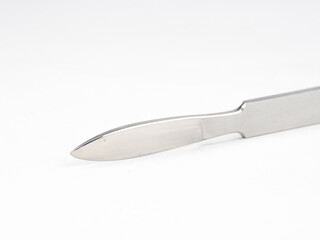 the steel medical scalpel on a white background