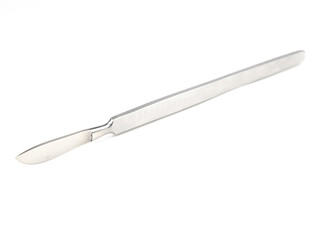 the steel medical scalpel on a white background