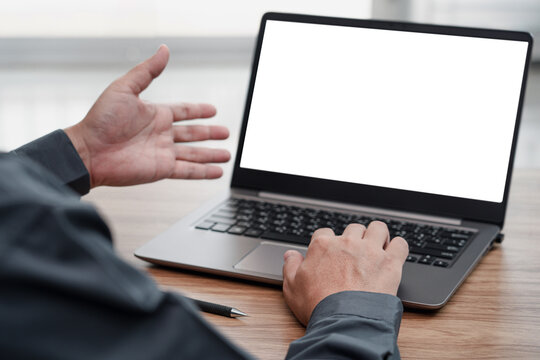 Action working concept : Close up hand typing on keyboard laptop computer and white scren display of laptop monitor  work in office